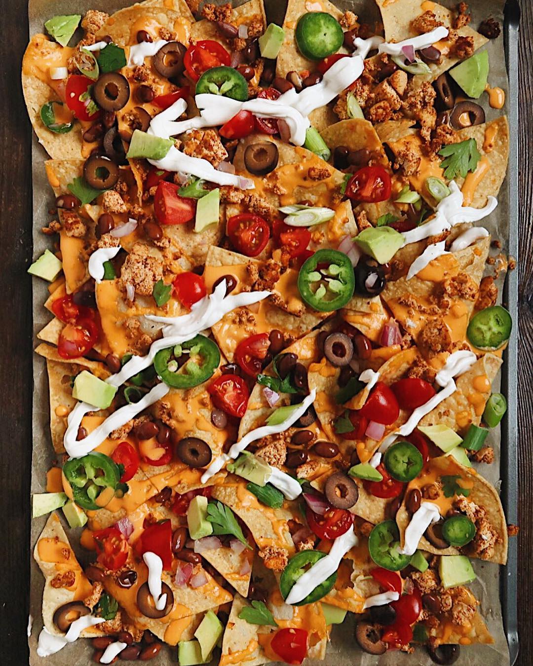Loaded Vegan Nachos: Tortilla Chips topped with homemade cheddar cheese ...